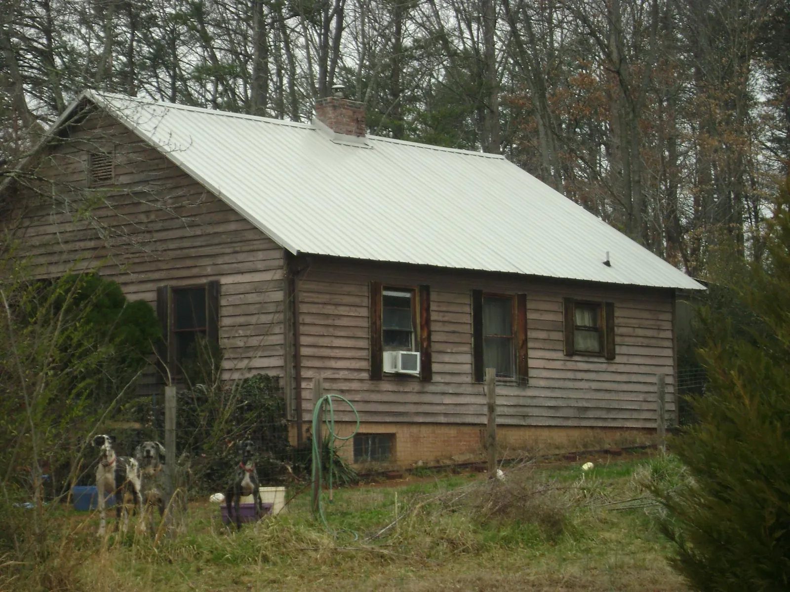 White metal roof on an old wood sided farmhouse in Browns Mills